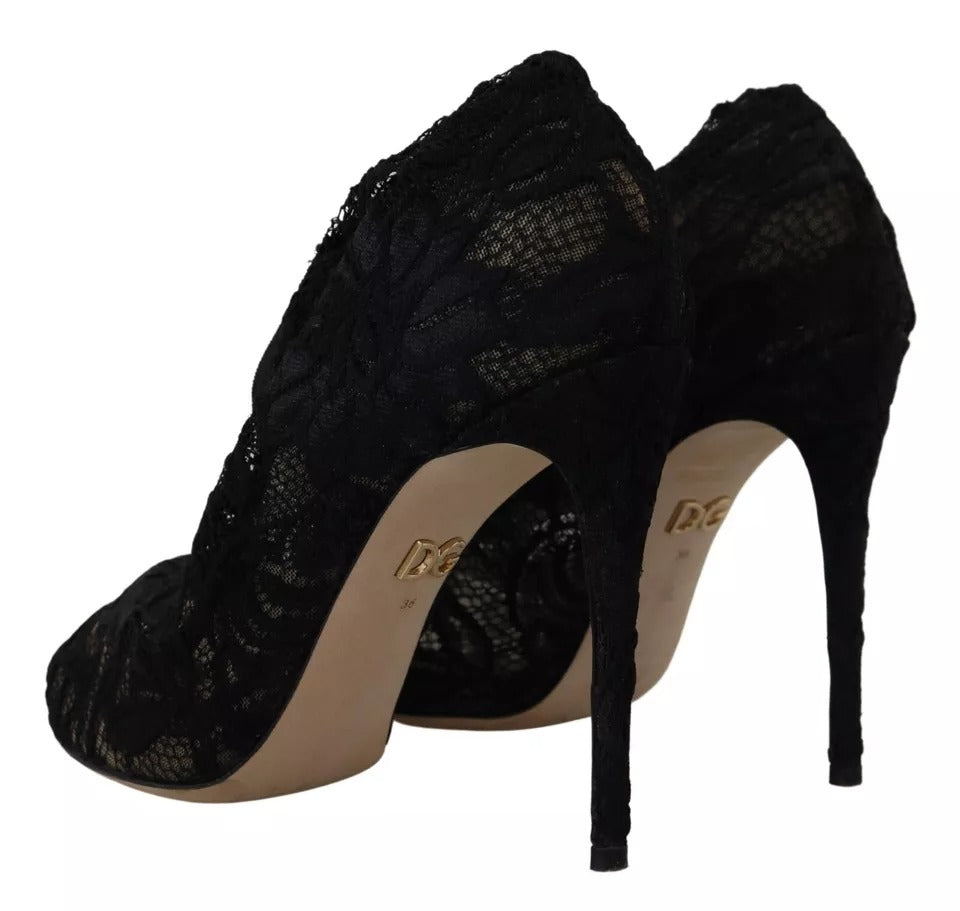 Indulge in the exquisite elegance of Dolce & Gabbana's Black Stretch Socks Taormina Lace Boots, crafted in Italy for unparalleled luxury and timeless style.