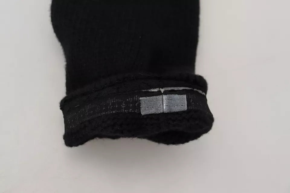 Indulge in the exquisite Dolce & Gabbana Black Wool Knit Calf Long Socks, crafted from 100% virgin wool, embodying timeless elegance and luxurious comfort for the discerning individual.