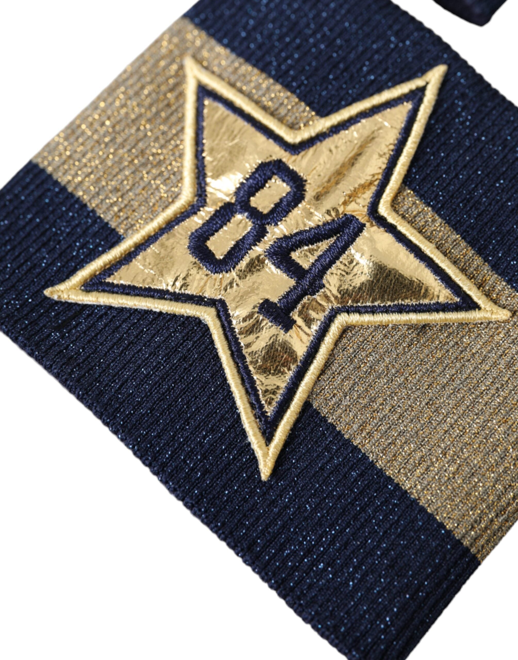 Elevate your style with the Dolce & Gabbana Black Gold Logo Star 84 Viscose Wristband, a luxurious blend of silk and viscose that embodies sophistication and timeless elegance.