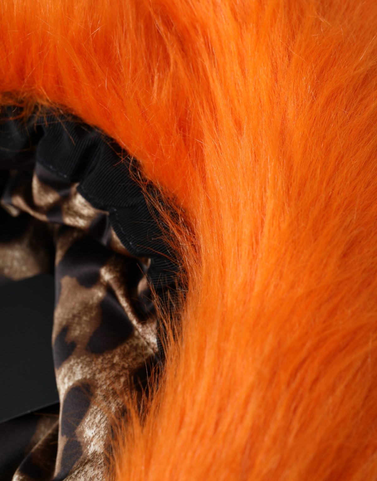 Elevate your style with the Dolce & Gabbana Orange Faux Fur Polyester Fedora Hat, a masterpiece of Italian craftsmanship that embodies luxury and sophistication for discerning tastes.