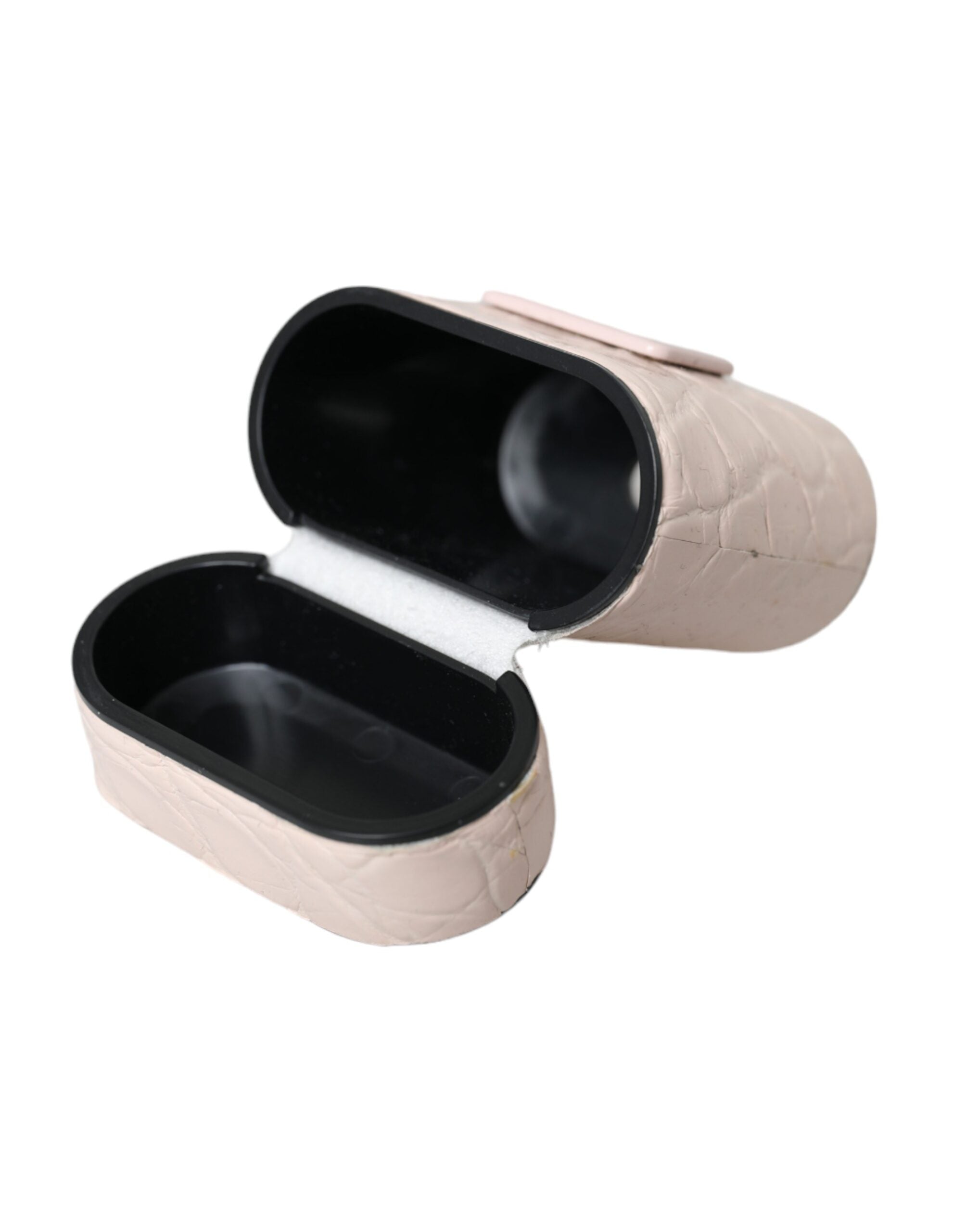 Indulge in the exquisite Dolce & Gabbana Light Pink Leather Airpods Case, a luxurious blend of artisanal craftsmanship and sophisticated design, perfect for the discerning individual.