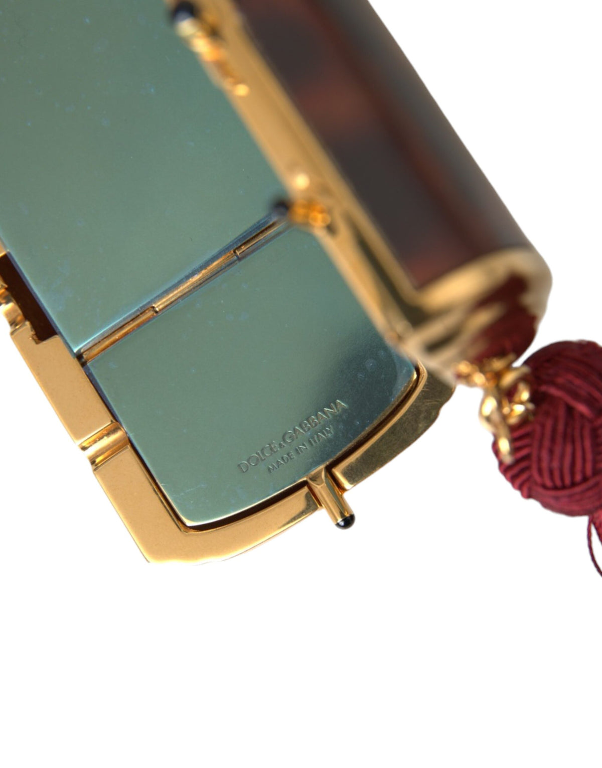 Indulge in the exquisite Dolce & Gabbana Brown Leopard Mini Mirror Tassel Makeup Holder Bag, a luxurious blend of 100% leather and gold detailing, crafted in Italy for the discerning individual.