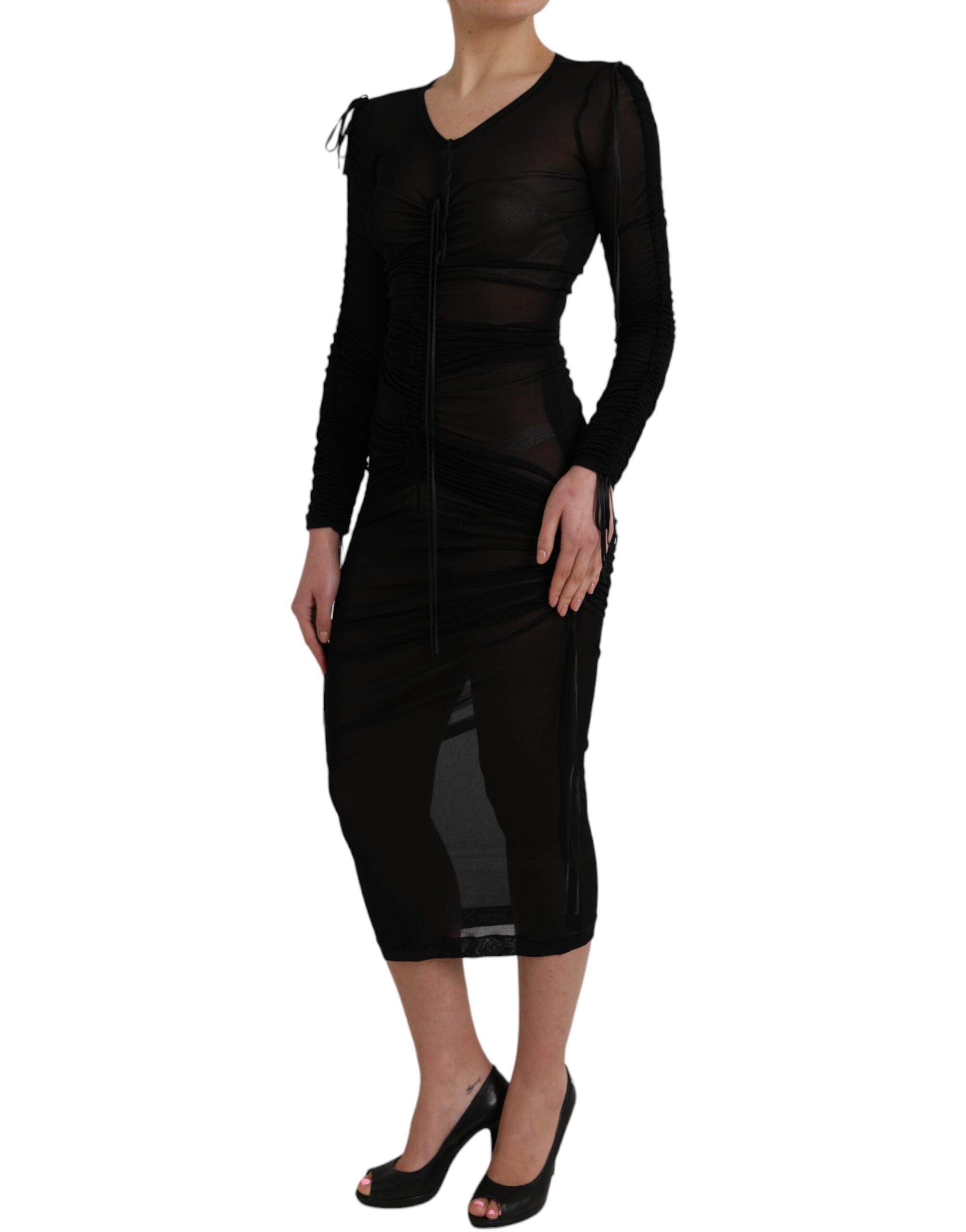 Indulge in the exquisite Dolce & Gabbana Black Sheer Bodycon Sheath Midi Dress, crafted from a luxurious silk blend, embodying timeless sophistication and sensual elegance.