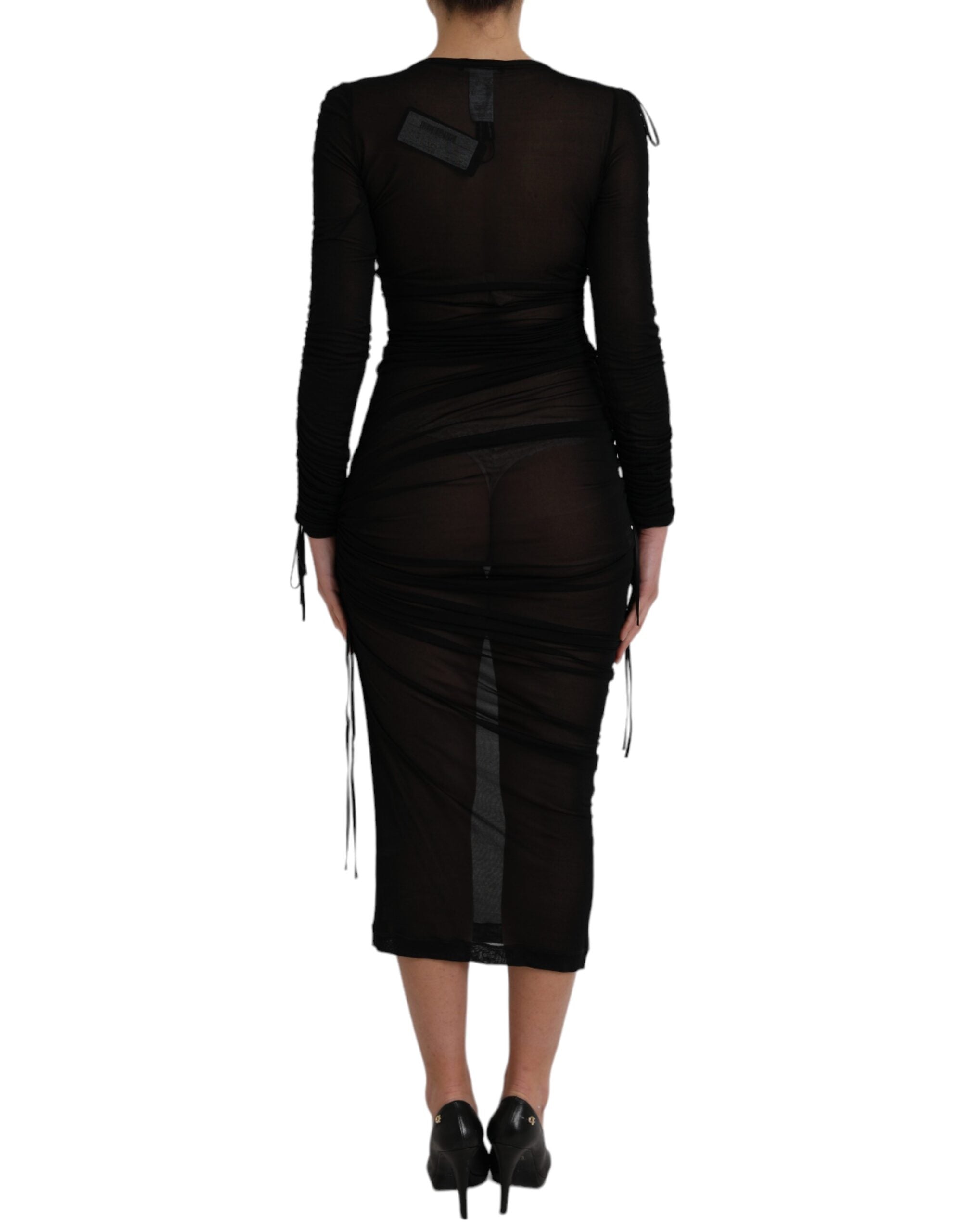 Experience the allure of the Dolce & Gabbana Black Sheer Bodycon Sheath Midi Dress, crafted from a luxurious silk blend, embodying timeless elegance and sophisticated sensuality.