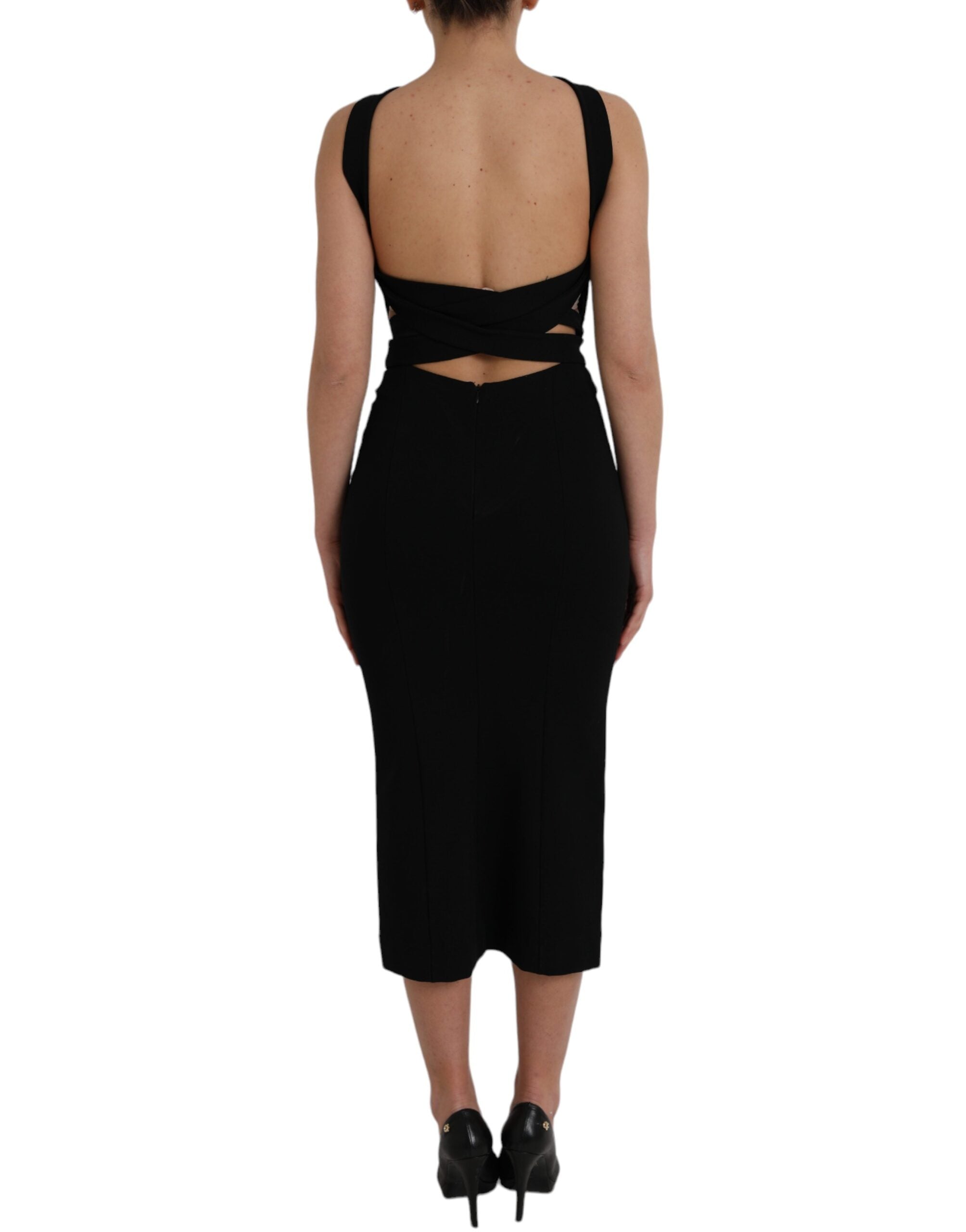 Indulge in the exquisite allure of the Dolce & Gabbana Black Sheath Halter Sleeveless Midi Dress, a timeless masterpiece of Italian craftsmanship that embodies luxury and sophistication.