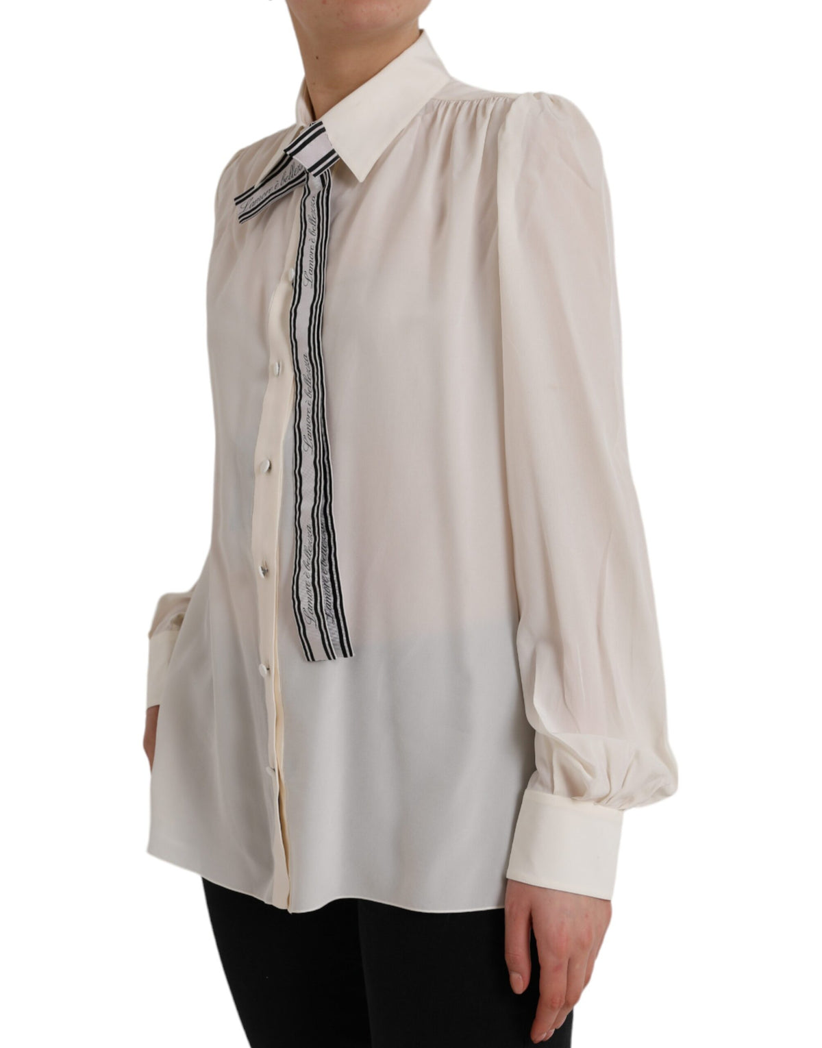 Indulge in the exquisite allure of the Dolce & Gabbana Off White Long Sleeve Button Down Blouse, crafted from luxurious silk, embodying timeless elegance and sophisticated charm.