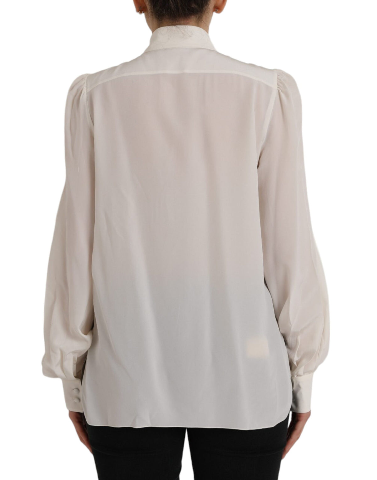 Experience the allure of Dolce & Gabbana's Off White Long Sleeve Button Down Blouse, crafted from luxurious silk, embodying timeless elegance and sophisticated charm.