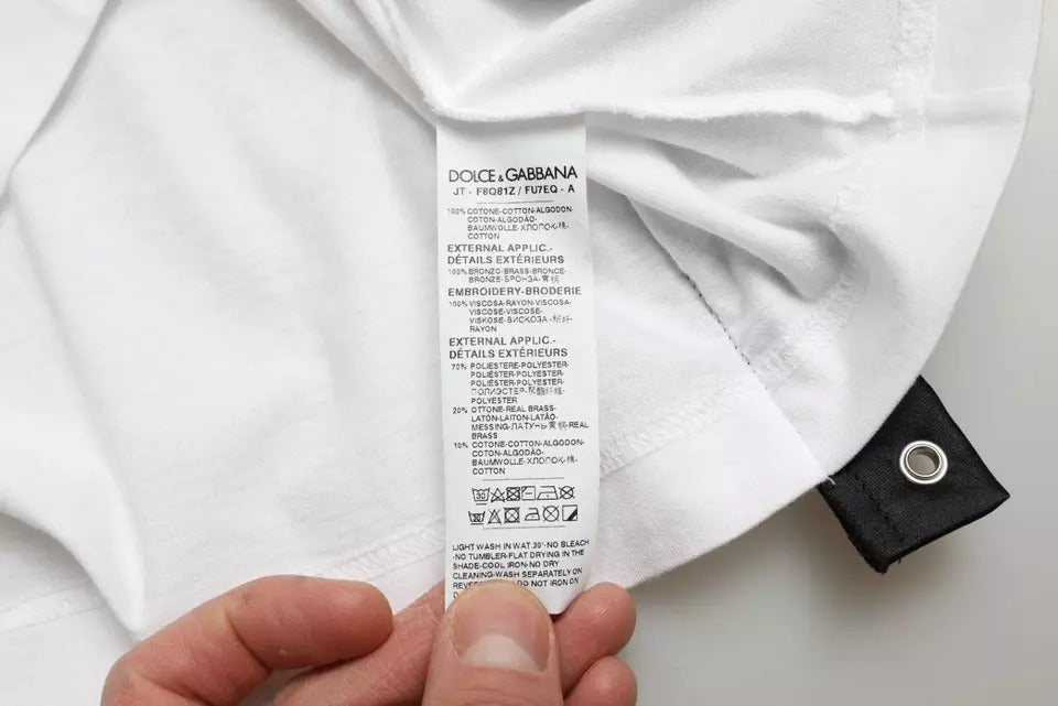 Indulge in the allure of Dolce & Gabbana's White Slogan Print Lacing Detailed T-shirt, a luxurious 100% cotton piece that embodies Italian craftsmanship and timeless elegance.