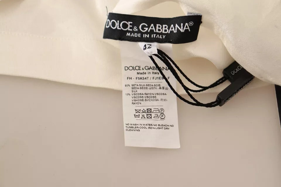 Indulge in the exquisite Dolce & Gabbana White Blouse, a silk and viscose masterpiece that embodies timeless elegance and sophistication for every occasion.