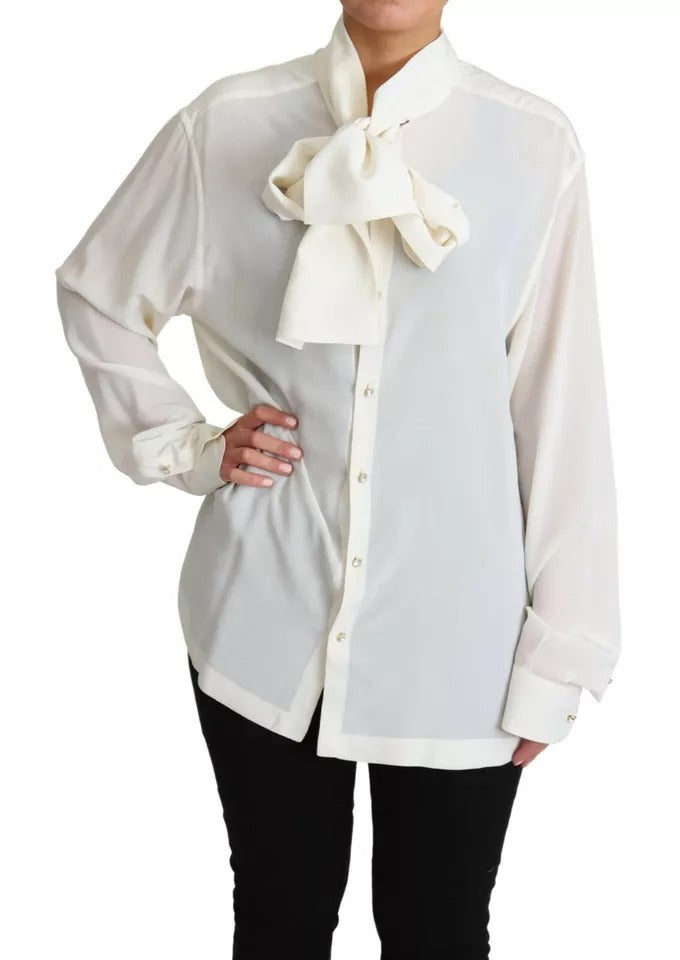 Experience the allure of Dolce & Gabbana's White Blouse, a silk masterpiece that embodies timeless elegance and sophistication for the discerning individual.