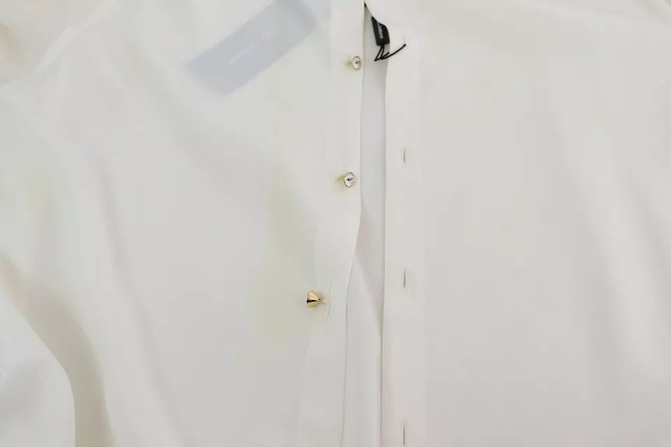 Elevate your wardrobe with the Dolce & Gabbana White Blouse, a silk masterpiece that embodies timeless elegance and luxurious allure for the discerning individual.