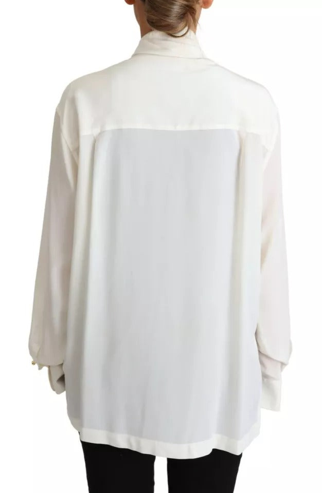 Experience the allure of Dolce & Gabbana's White Blouse, crafted from 100% silk jersey, embodying timeless elegance and luxurious sophistication for the discerning individual.