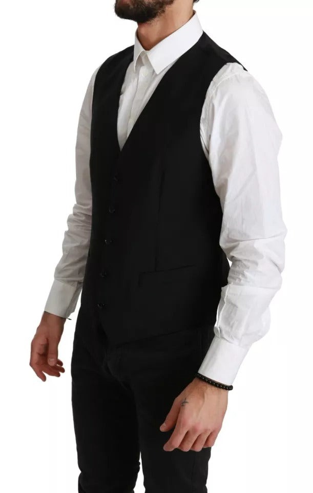 Elevate your wardrobe with the Dolce & Gabbana Black Stretch Waistcoat, a masterful blend of virgin wool and elegance, embodying timeless sophistication and Italian craftsmanship.