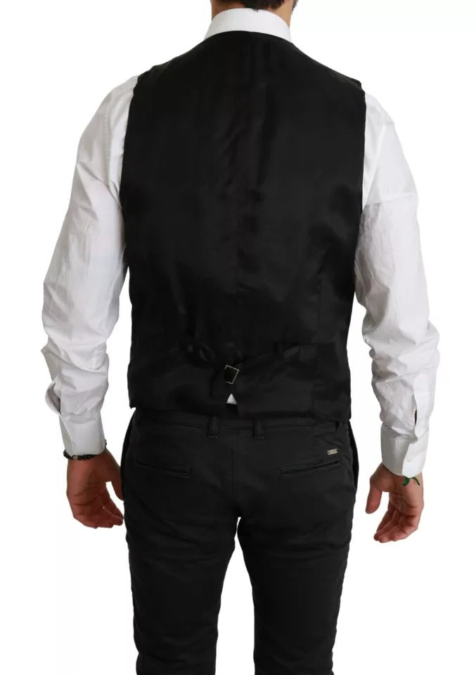Discover the Dolce & Gabbana Black Stretch Waistcoat, a masterpiece of Italian craftsmanship in luxurious wool blend, epitomizing timeless elegance and sophistication.