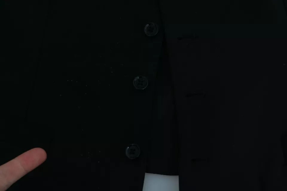Elevate your wardrobe with the Dolce & Gabbana Black Stretch Waistcoat, a luxurious blend of virgin wool and elegance, embodying timeless sophistication and Italian craftsmanship.