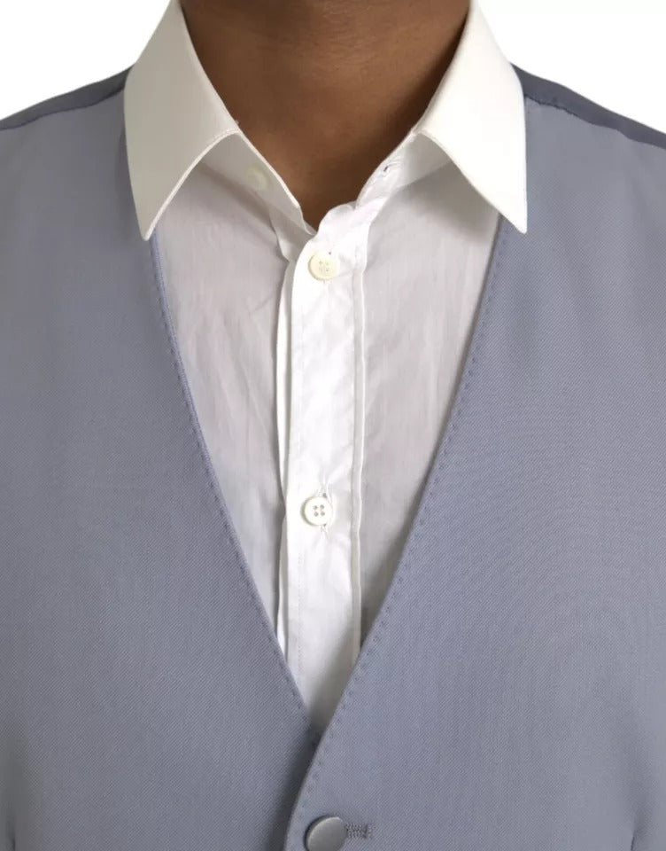 Indulge in the exquisite Dolce & Gabbana Light Blue Wool Formal Dress Waistcoat Vest, a masterpiece of luxury craftsmanship that embodies timeless elegance and sophistication.