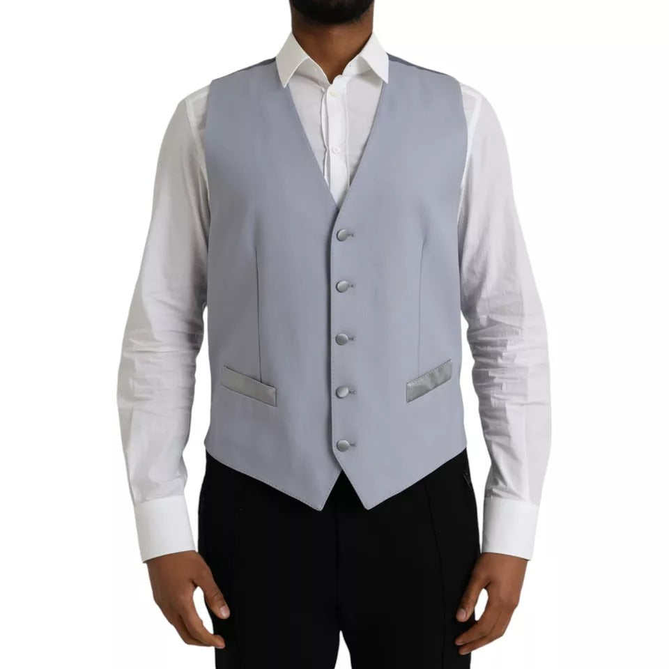Indulge in the exquisite Dolce & Gabbana Light Blue Wool Formal Dress Waistcoat Vest, a timeless symbol of luxury crafted from premium materials, perfect for the discerning individual.