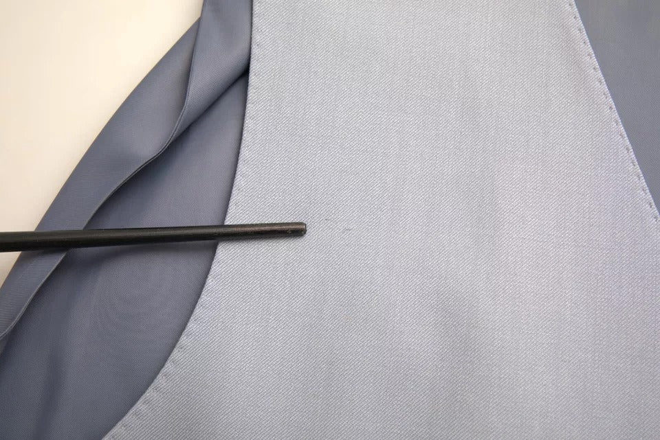Indulge in the exquisite Dolce & Gabbana Light Blue Wool Formal Dress Waistcoat Vest, a symbol of timeless elegance crafted for those who embody luxury and sophistication.