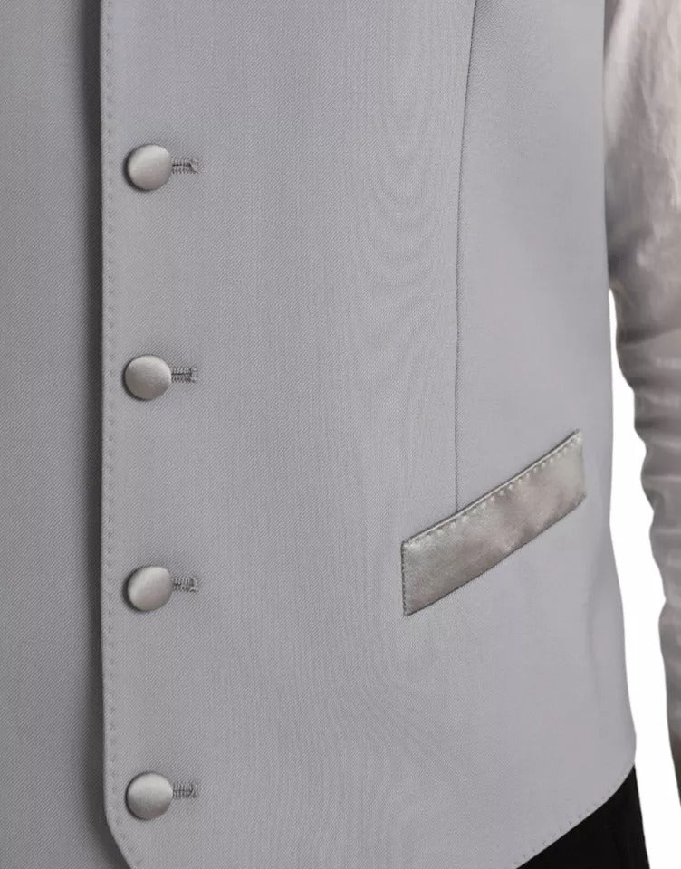Elevate your elegance with the Dolce & Gabbana Light Blue Wool Formal Dress Waistcoat Vest, a masterpiece of luxurious craftsmanship designed for the discerning individual.