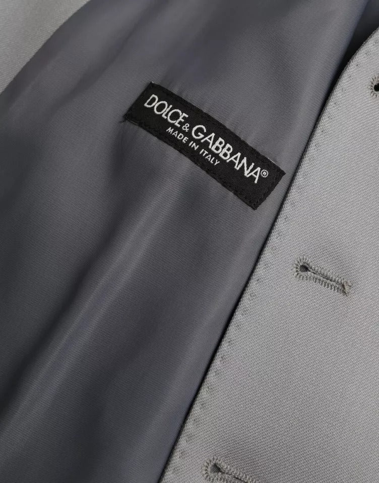Indulge in the exquisite Dolce & Gabbana Light Blue Wool Formal Dress Waistcoat Vest, a symbol of luxury crafted from fine materials, embodying timeless elegance and sophistication.