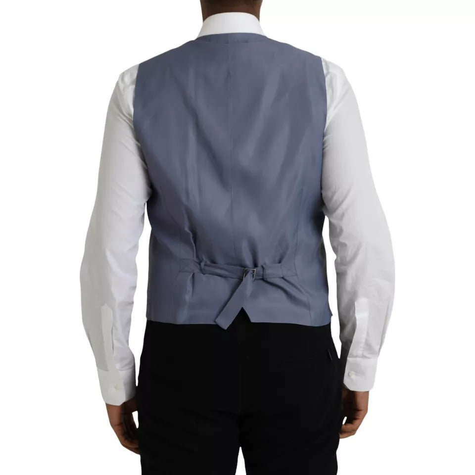 Indulge in the exquisite Dolce & Gabbana Light Blue Wool Formal Dress Waistcoat Vest, a timeless piece that embodies luxury craftsmanship and sophisticated elegance.