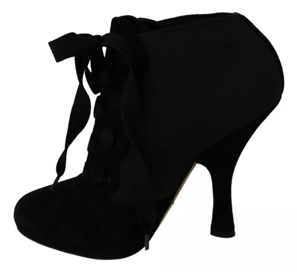 Indulge in the exquisite Dolce & Gabbana Black Suede Stretch Ankle Boots, where luxurious Capra suede meets timeless elegance, perfect for the discerning fashion connoisseur.