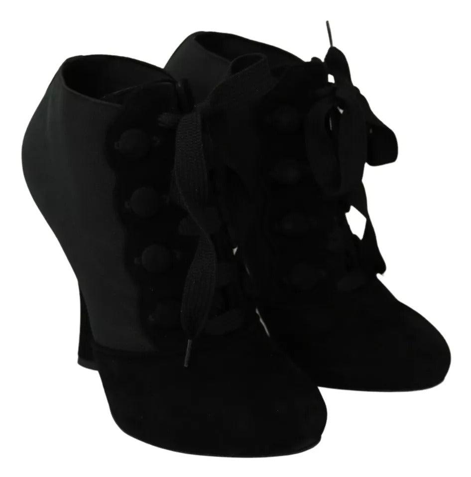 Indulge in the allure of Dolce & Gabbana Black Suede Stretch Ankle Boots, where exquisite craftsmanship meets timeless elegance, perfect for the discerning individual.