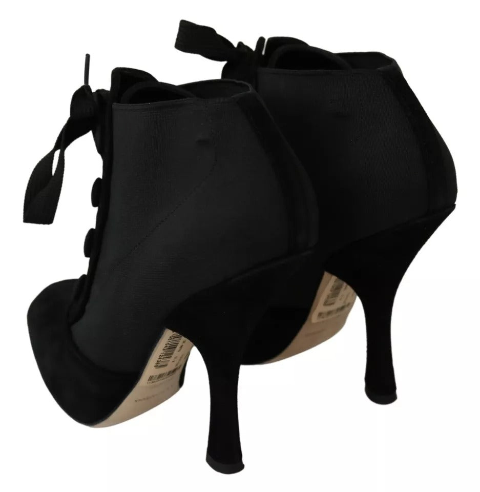 Indulge in the allure of Dolce & Gabbana Black Suede Stretch Ankle Boots, where exquisite craftsmanship meets timeless elegance, designed for the discerning individual.