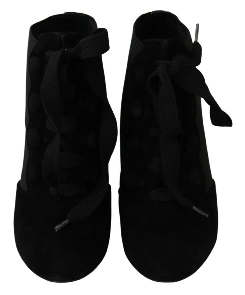 Indulge in the allure of Dolce & Gabbana Black Suede Stretch Ankle Boots, where exquisite craftsmanship meets timeless elegance, perfect for the discerning connoisseur.