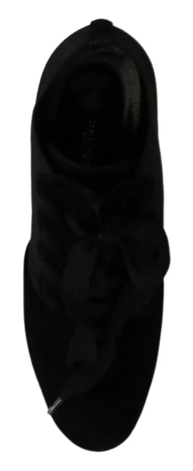 Indulge in the exquisite Dolce & Gabbana Black Suede Stretch Ankle Boots, where Italian craftsmanship meets timeless elegance, perfect for the discerning individual.