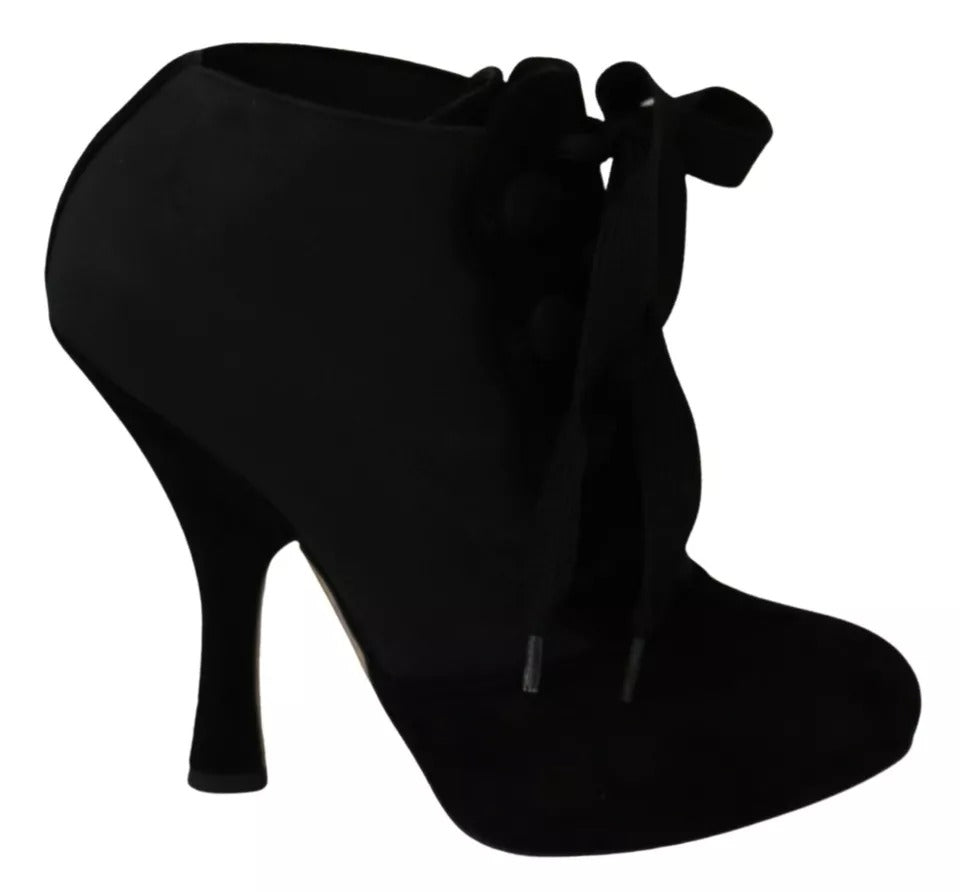 Indulge in the elegance of Dolce & Gabbana Black Suede Stretch Ankle Boots, where exquisite craftsmanship meets timeless luxury, perfect for the discerning individual.