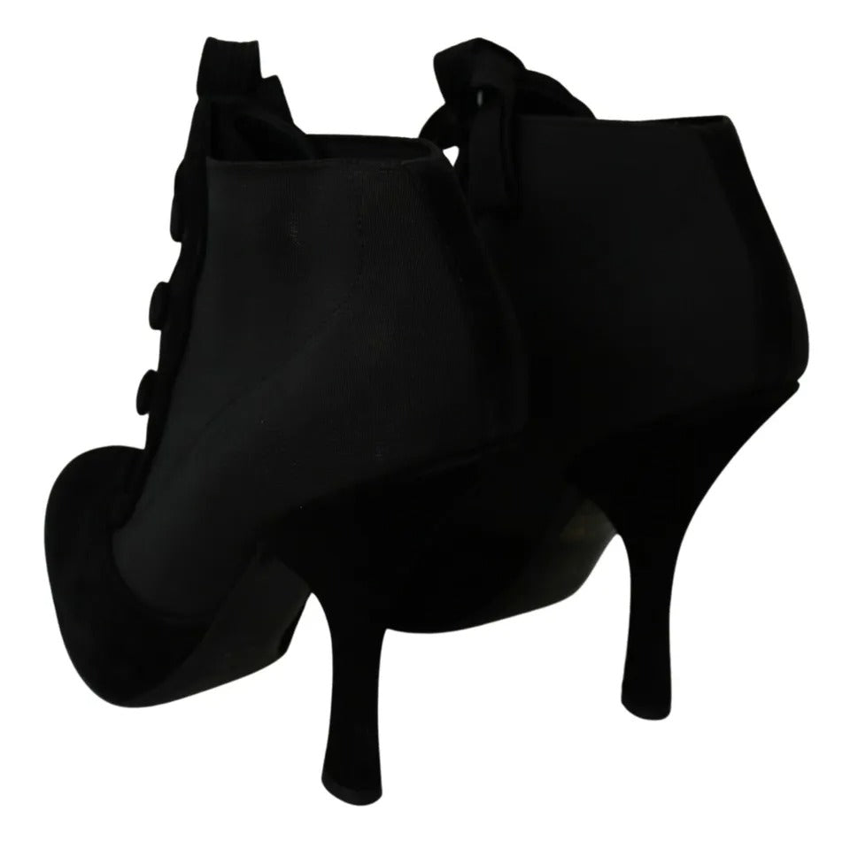 Indulge in the exquisite allure of Dolce & Gabbana's Black Suede Stretch Ankle Boots, where luxurious capra suede meets Italian craftsmanship for timeless elegance.
