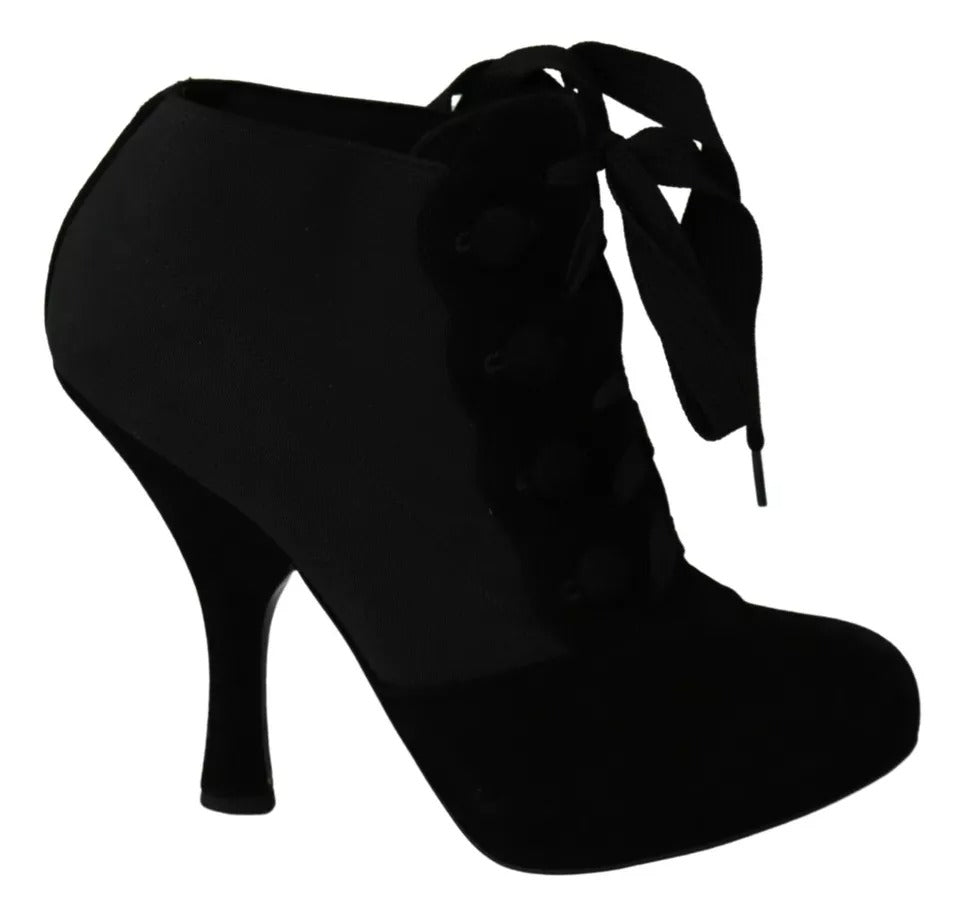 Indulge in the exquisite Dolce & Gabbana Black Suede Stretch Ankle Boots, where Italian craftsmanship meets luxurious capra suede for timeless elegance and allure.