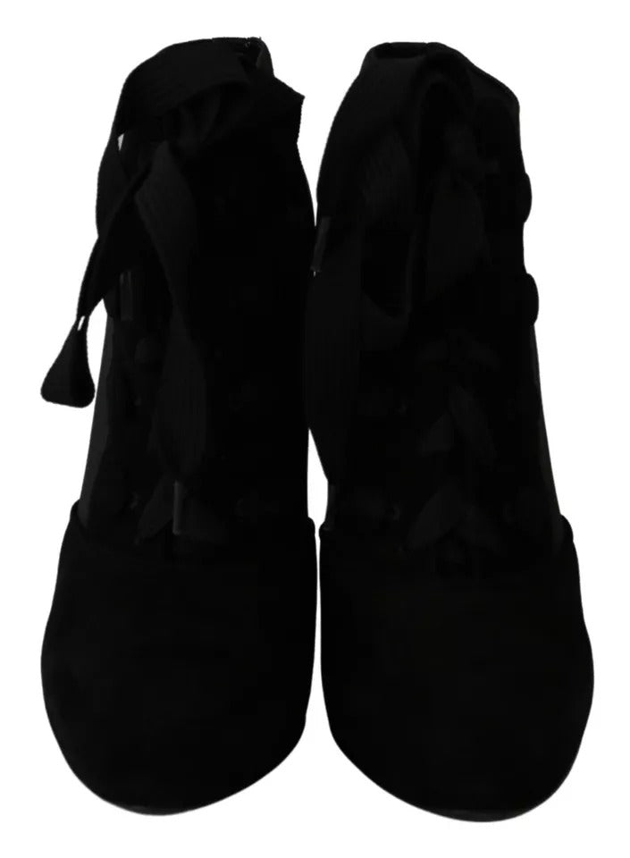 Indulge in the allure of Dolce & Gabbana's Black Suede Stretch Ankle Boots, where exquisite capra suede and Italian craftsmanship redefine luxury and sophistication.