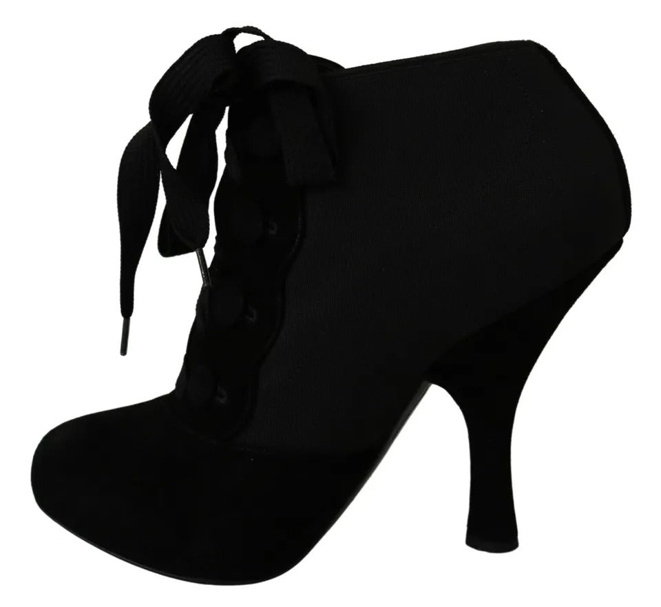 Indulge in the exquisite Dolce & Gabbana Black Suede Stretch Ankle Boots, where luxurious capra suede meets Italian craftsmanship, elevating your style with timeless elegance.