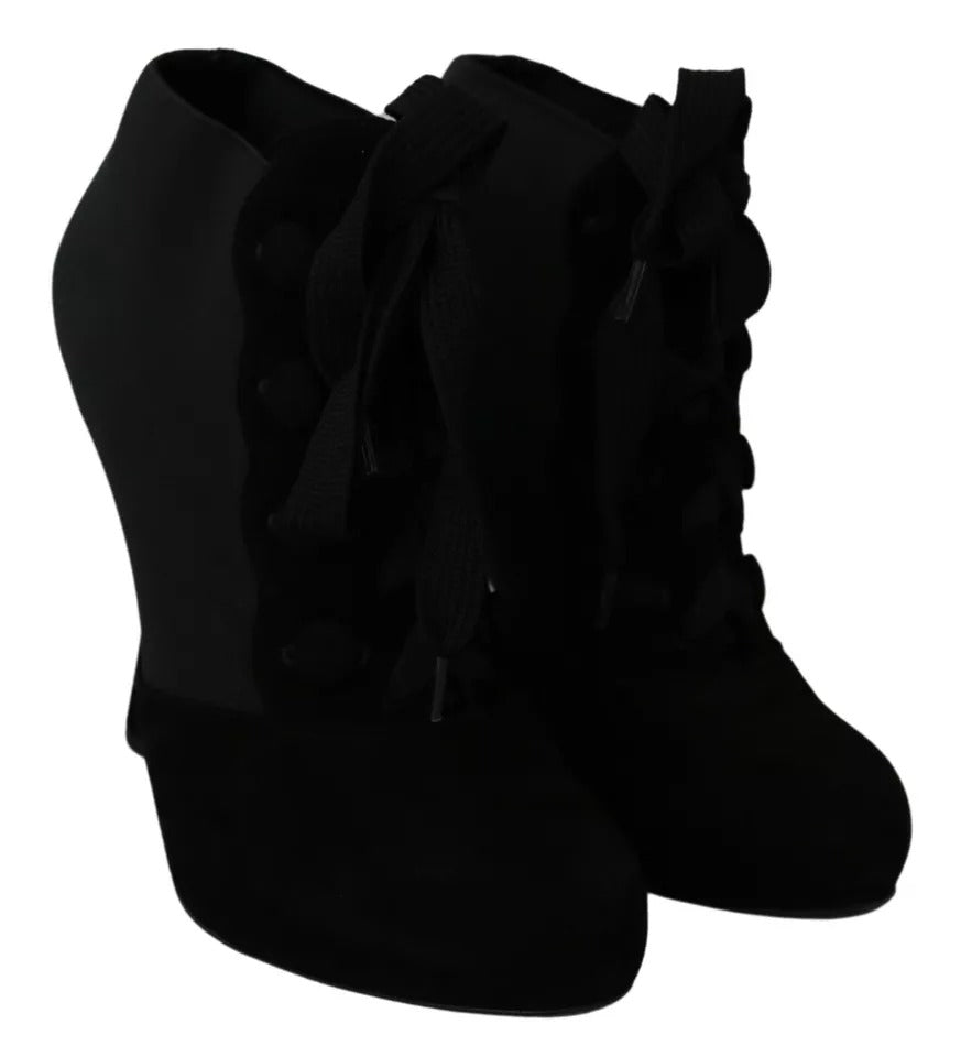 Indulge in the exquisite Dolce & Gabbana Black Suede Stretch Ankle Boots, where luxurious capra suede meets Italian artistry, perfect for elevating any ensemble.