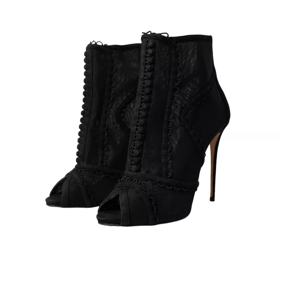 Indulge in the exquisite allure of Dolce & Gabbana's Black Tulle Stiletto Heels, where luxurious craftsmanship meets timeless elegance, perfect for any sophisticated occasion.