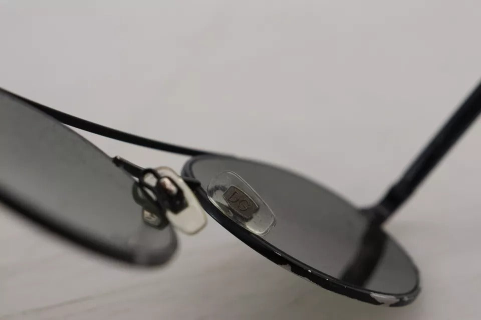 Indulge in the allure of Dolce & Gabbana DG2245 sunglasses, where exquisite matte black steel meets vibrant green lenses, embodying timeless elegance for the discerning connoisseur.