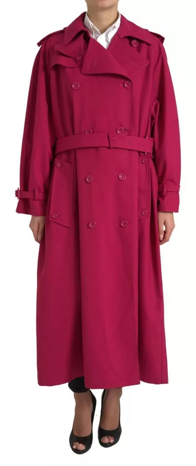 Indulge in the exquisite Dolce & Gabbana Dark Pink Double Breasted Trench Coat, a luxurious blend of 55% polyester and 45% virgin wool, embodying timeless elegance and unparalleled craftsmanship.