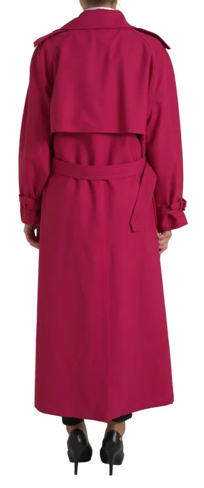 Experience the exquisite Dolce & Gabbana Dark Pink Double Breasted Trench Coat, a luxurious blend of 55% polyester and 45% virgin wool, embodying timeless elegance and refined craftsmanship.