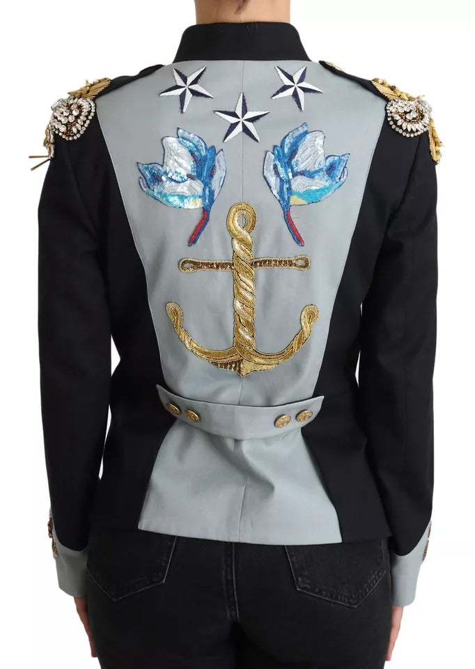 Discover the Dolce & Gabbana Blue Button Crystal Embellished Cotton Jacket, a luxurious blend of cotton and silk, embodying exquisite craftsmanship for the discerning individual.