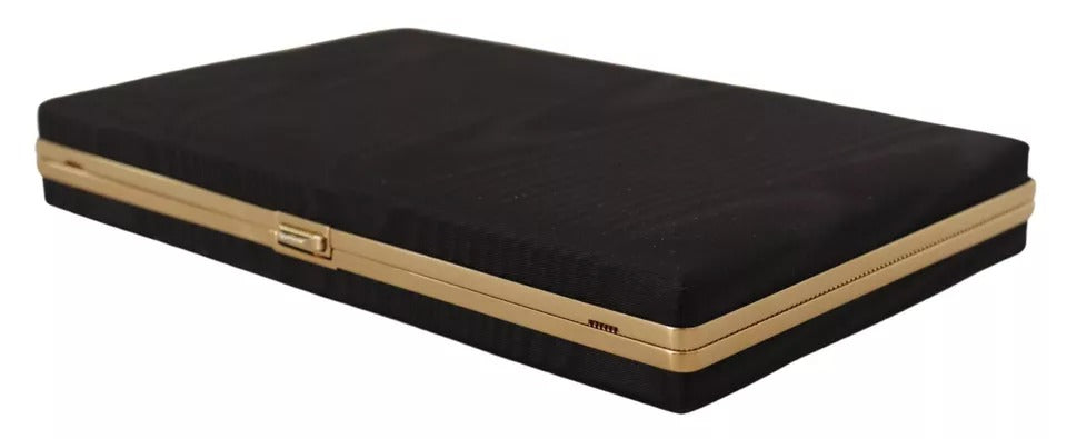 Indulge in the exquisite Dolce & Gabbana Black Silk Gold Frame Clutch, a timeless masterpiece of Italian craftsmanship, perfect for elevating your evening allure.
