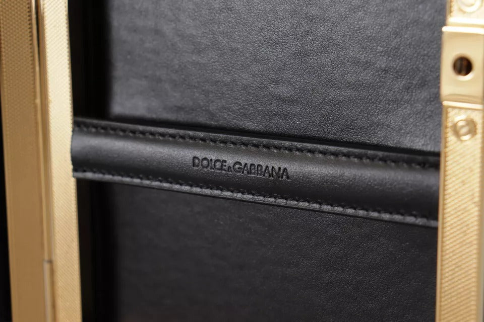 Indulge in the opulence of the Dolce & Gabbana Black Silk Gold Frame Clutch, a timeless accessory crafted from luxurious silk and leather, perfect for elevating any evening ensemble.