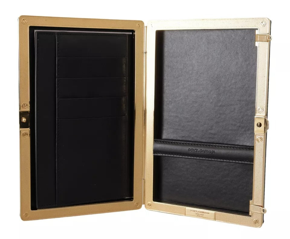 Indulge in the exquisite allure of the Dolce & Gabbana Black Silk Gold Frame Clutch, a masterpiece of Italian craftsmanship that elevates any evening ensemble with timeless elegance.