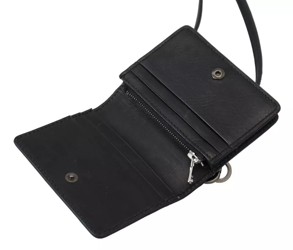 Indulge in the exquisite Dolce & Gabbana Black Leather Bifold Shoulder Sling Wallet, a masterpiece of Italian craftsmanship that embodies timeless elegance and luxury.