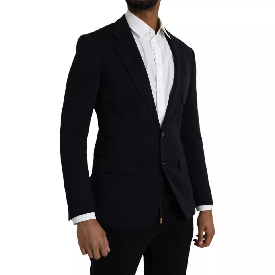 Elevate your wardrobe with the Dolce & Gabbana Blue Wool Notch Single Breasted Coat Blazer, a masterpiece of Italian craftsmanship blending luxurious materials for timeless sophistication.