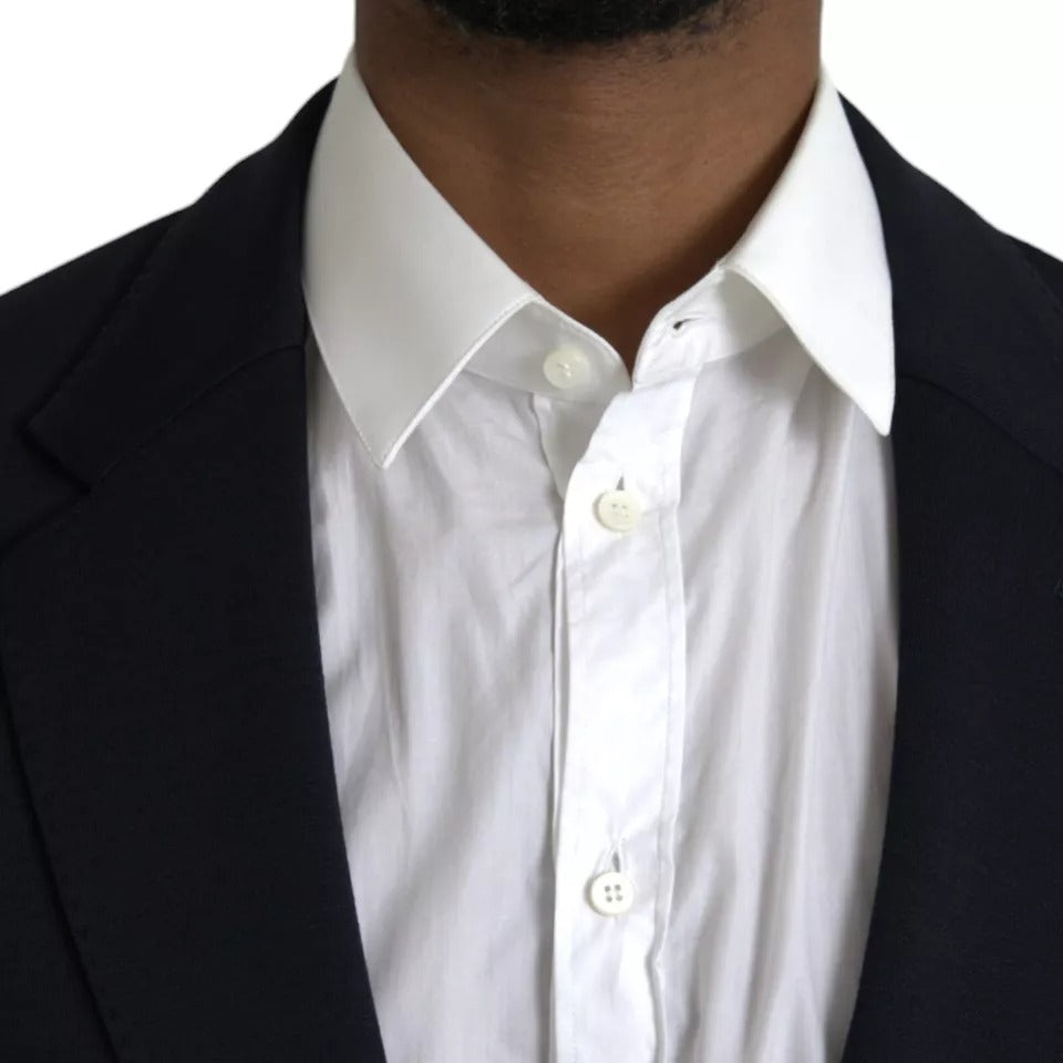 Elevate your wardrobe with the Dolce & Gabbana Blue Wool Notch Single Breasted Coat Blazer, a masterpiece of Italian craftsmanship blending luxurious materials for timeless sophistication.
