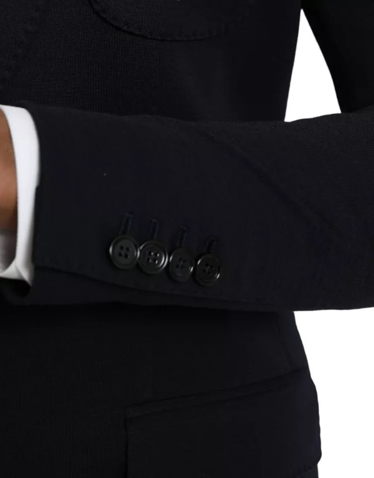 Elevate your wardrobe with the Dolce & Gabbana Blue Wool Notch Single Breasted Coat Blazer, a masterpiece of Italian craftsmanship blending luxurious materials for timeless elegance.
