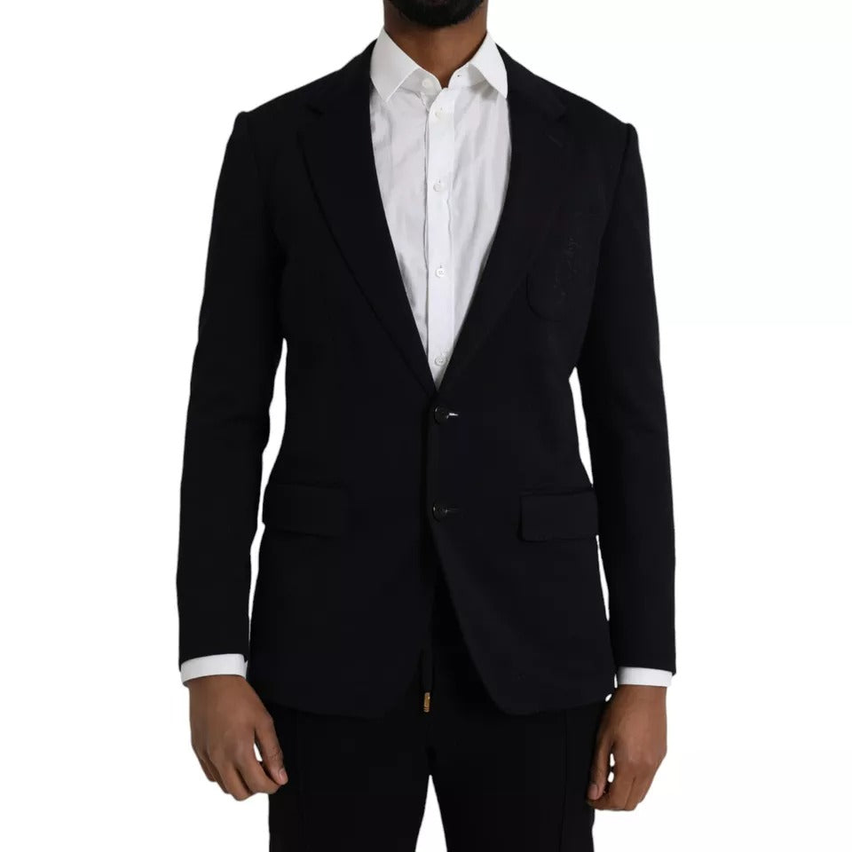 Elevate your wardrobe with the Dolce & Gabbana Blue Wool Notch Single Breasted Coat Blazer, a masterpiece of Italian craftsmanship blending luxurious virgin wool and silk for timeless sophistication.