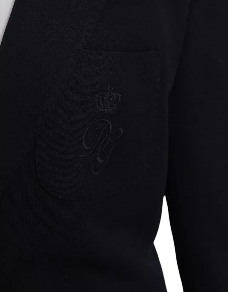 Elevate your wardrobe with the Dolce & Gabbana Blue Wool Notch Single Breasted Coat Blazer, a masterpiece of Italian craftsmanship in luxurious virgin wool and silk.